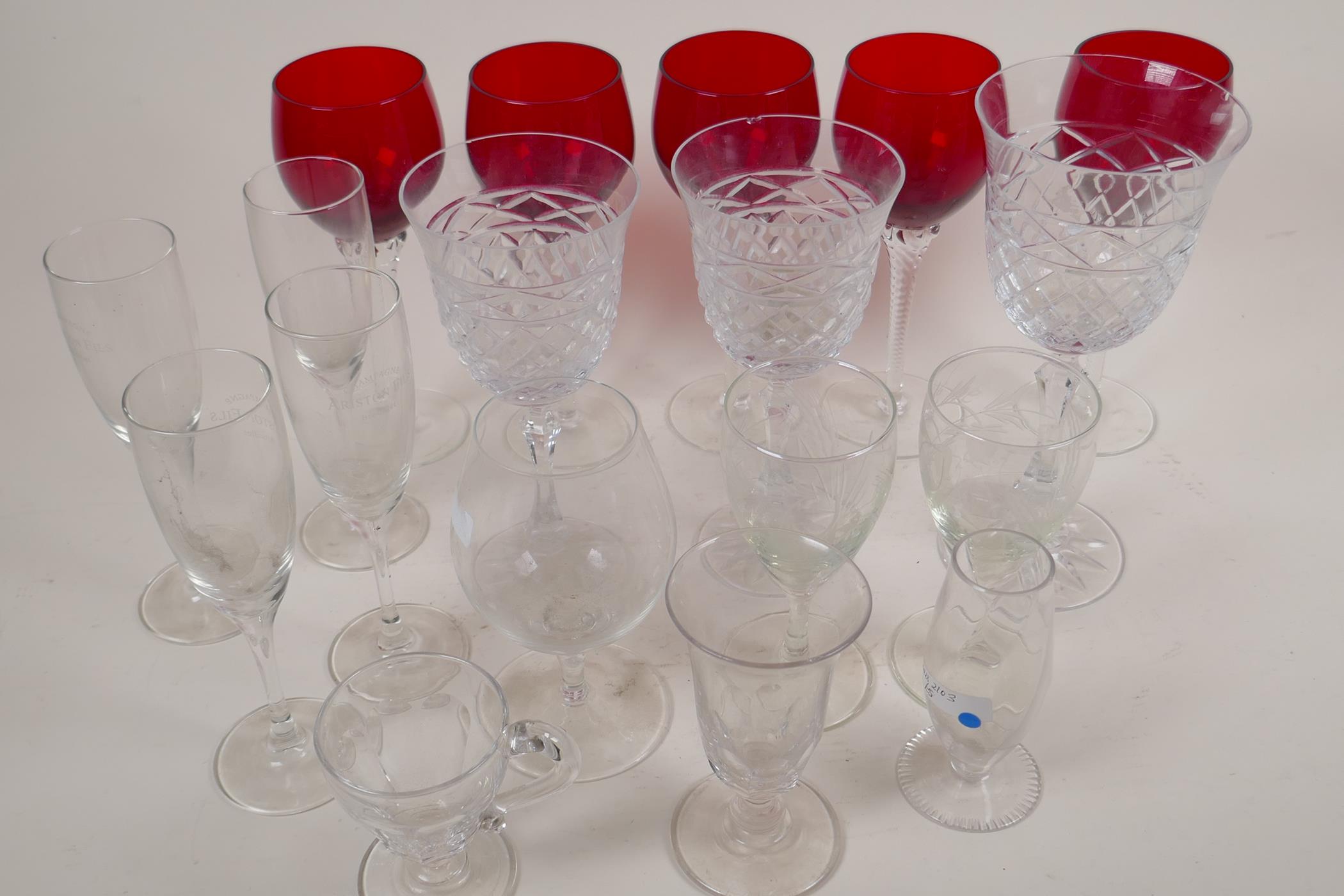 A quantity of wine glasses to include a set of five ruby on clear twist stems, Galway Goblets etc