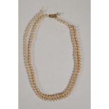 A Ciro pearl necklace with 9ct gold clasp, 18" long, and a string