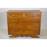 A Continental pine chest of two over three drawers, with moulded decoration, raised on a shaped