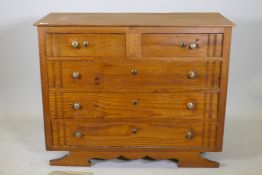 A Continental pine chest of two over three drawers, with moulded decoration, raised on a shaped