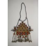 A Turkman metal ceremonial necklace with gilt and silvered details, ruby coloured stone settings and
