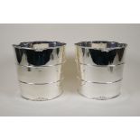 A pair of silver plated ice buckets with banded decoration, 8" diameter, 8" high