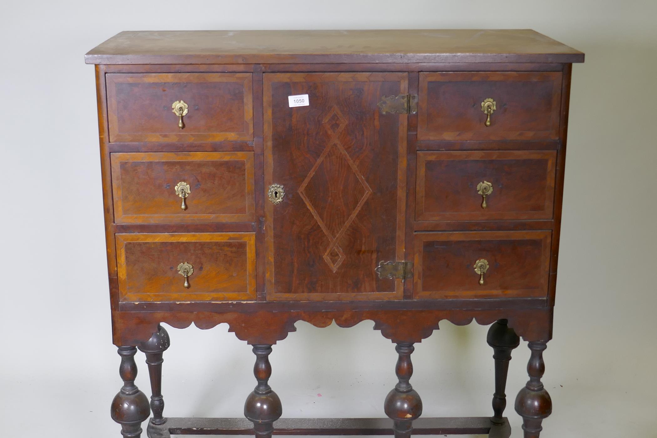 A C19th walnut cabinet on stand, with feather banded inlaid decoration, six drawers and central - Image 2 of 8