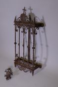 A vintage wall mounted wrought metal garden bracket, with night light holder, 34" x 15" x 6"