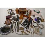 A collection of decorative items to include treen, cigarette lighters, silver plated mirror,