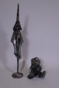 A metal figure of a wizard and another, 36" high