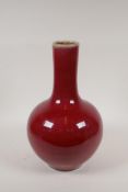 A Chinese sang de boeuf glazed porcelain bottle vase, 6 character mark to base, 14" high