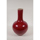 A Chinese sang de boeuf glazed porcelain bottle vase, 6 character mark to base, 14" high