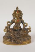 A Sino Tibetan gilt bronze figure of a seated deity with inset turquoise and red agate stones,