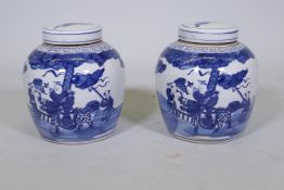 A pair of Chinese blue and white storage jars with covers, 10" high