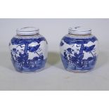 A pair of Chinese blue and white storage jars with covers, 10" high