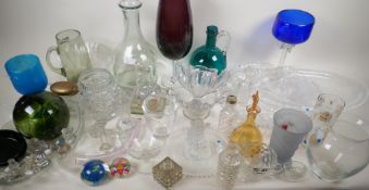 A quantity of ornamental glassware including fisherman's float, decanters, paperweights etc