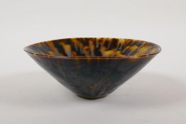 A Chinese Cizhou kiln conical bowl with a tortoise shell glaze, 6½" diameter