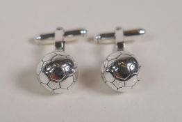 A pair of 925 silver football cufflinks