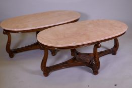 A pair of marble top occasional tables, raised on a carved base with shaped supports and