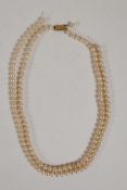 A Ciro pearl necklace with 9ct gold clasp, 18" long, and a string