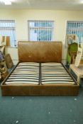 A leather upholstered double bed, 74" x 46" x 90"