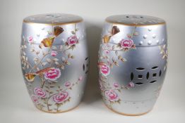 A pair of oriental porcelain barrel seats decorated with flowers, 18" high