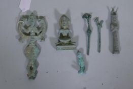 A collection of Middle Eastern metal votive figures, largest 6½" high