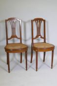 A pair of C19th continental neo-classical style mahogany and satinwood banded side chairs, with