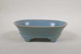 A Chinese Ru ware style oval dish on raised supports, 7½" x 5½"