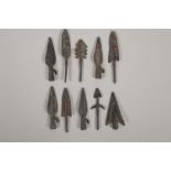 Ten archaic style bronze arrow heads, 3" long