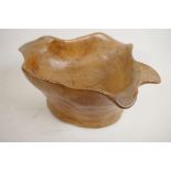 A carved root wood bowl, 7" high