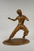 A bronze figure of Bruce Lee, 13½" high