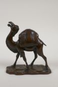 A Chinese bronze censer and cover in the form of a camel, impressed mark to base, 5½" high