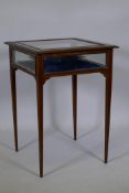 A mahogany bijouterie cabinet with satinwood inlaid decoration, bevelled glass top and panels,