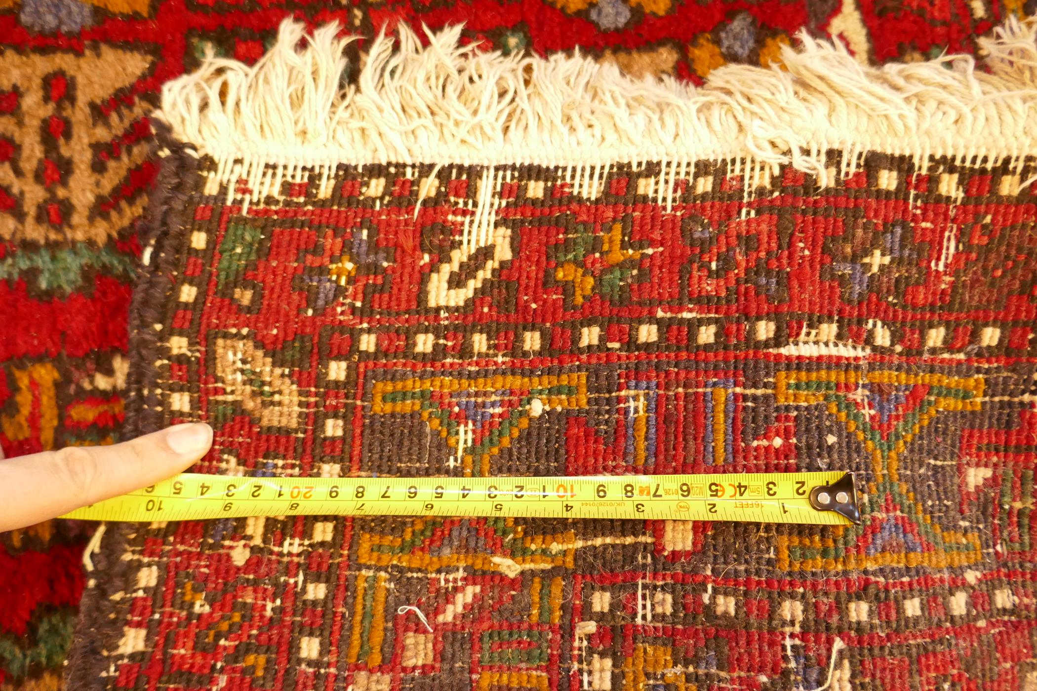 A thick pile red ground hand woven Persian Heriz runner with a cross medallion design, 42" x 138", - Image 7 of 7