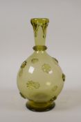 An antique yellow glass vase with decorative stars and drip decoration, 8" high