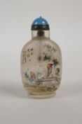 A Chinese reverse decorated glass snuff bottle depicting a musician and student, character