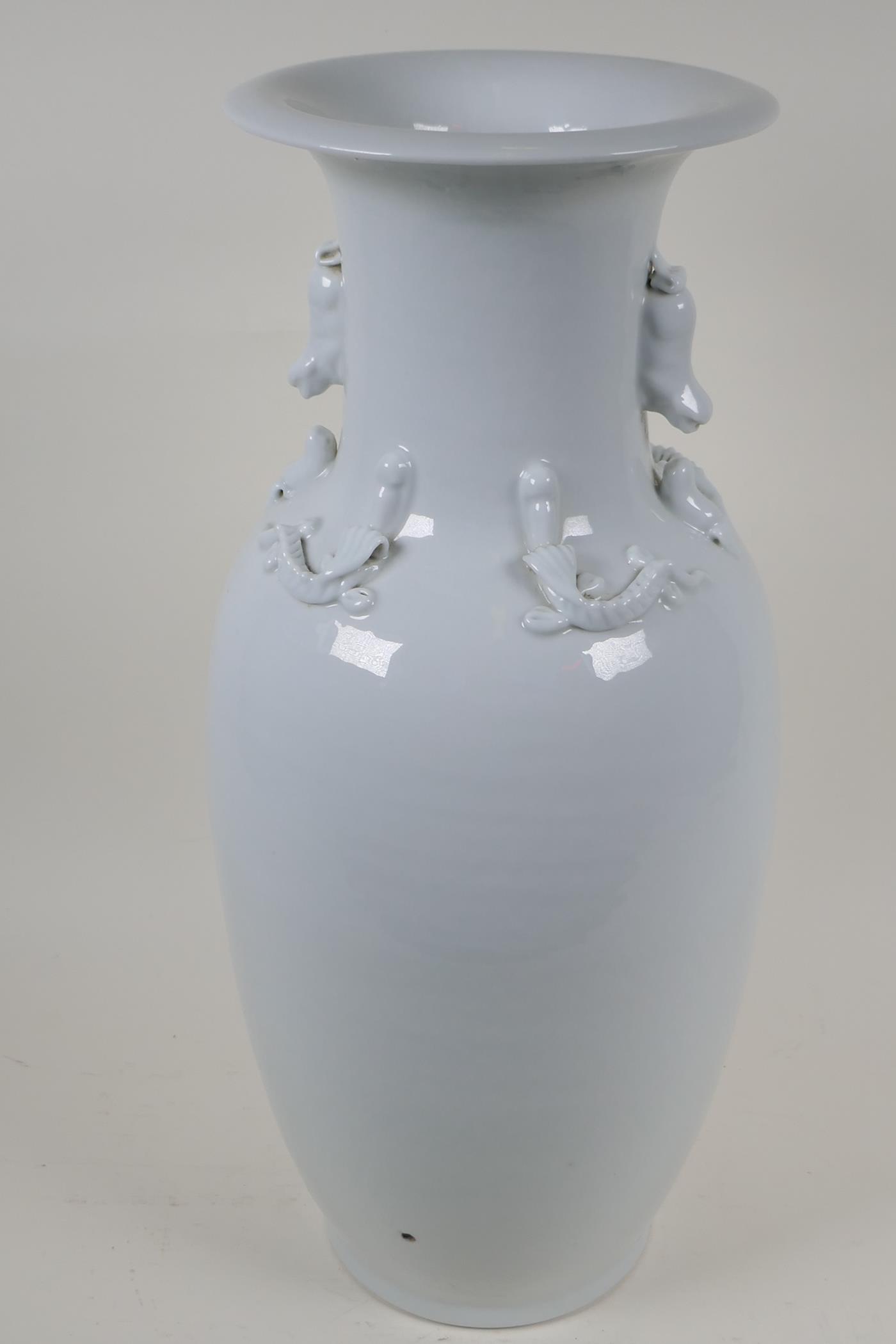 A Chinese blanc de chine porcelain vase with twin fo dog handles, the shoulder embossed with - Image 2 of 7