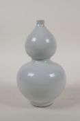 A Chinese cream glazed porcelain double gourd vase, 6½" high