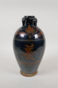 A Chinese Cizhou kiln pottery vase with lug handles and iridescent auspicious character