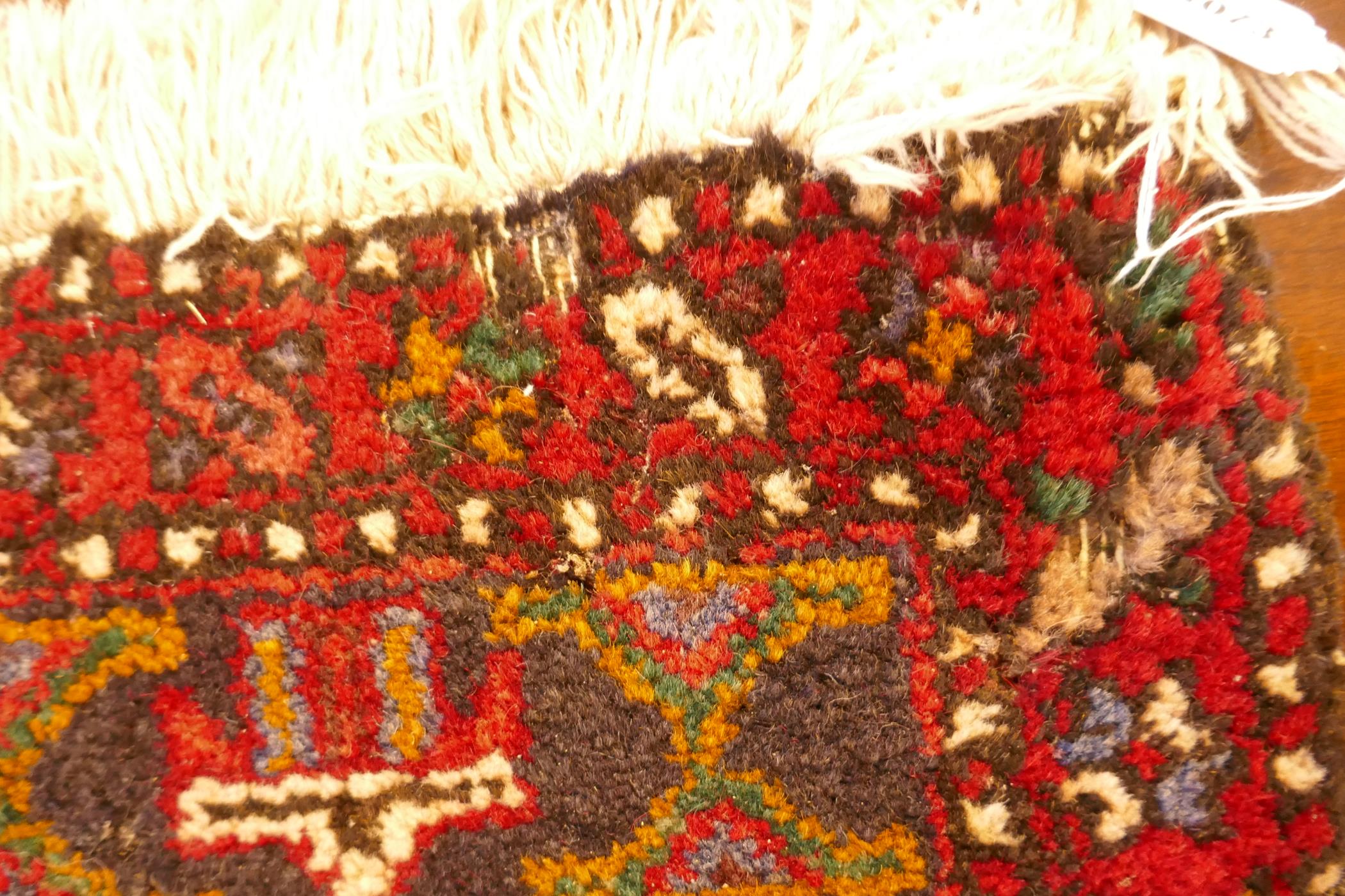 A thick pile red ground hand woven Persian Heriz runner with a cross medallion design, 42" x 138", - Image 5 of 7