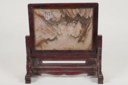 A Chinese stone and hardwood table screen, 9½" high x 9½" wide