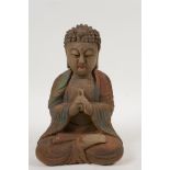 A Chinese carved and painted wood figure of Buddha, 8½" high