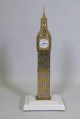 A 'Big Ben' brass skeleton clock with spring driven movement, mounted on a composite marble base,