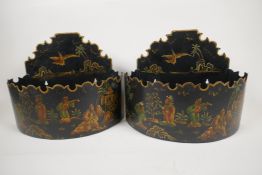 A pair of toleware wall planters with Japanned decoration of figures and birds, 11" wide