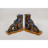 A pair of amber and blue drip glazed porcelain bookends in the form of Chinese rickshaw pullers, 6½"