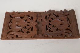 A Black Forest wood bookslide carved with vine leaves and fruit, 13" long closed