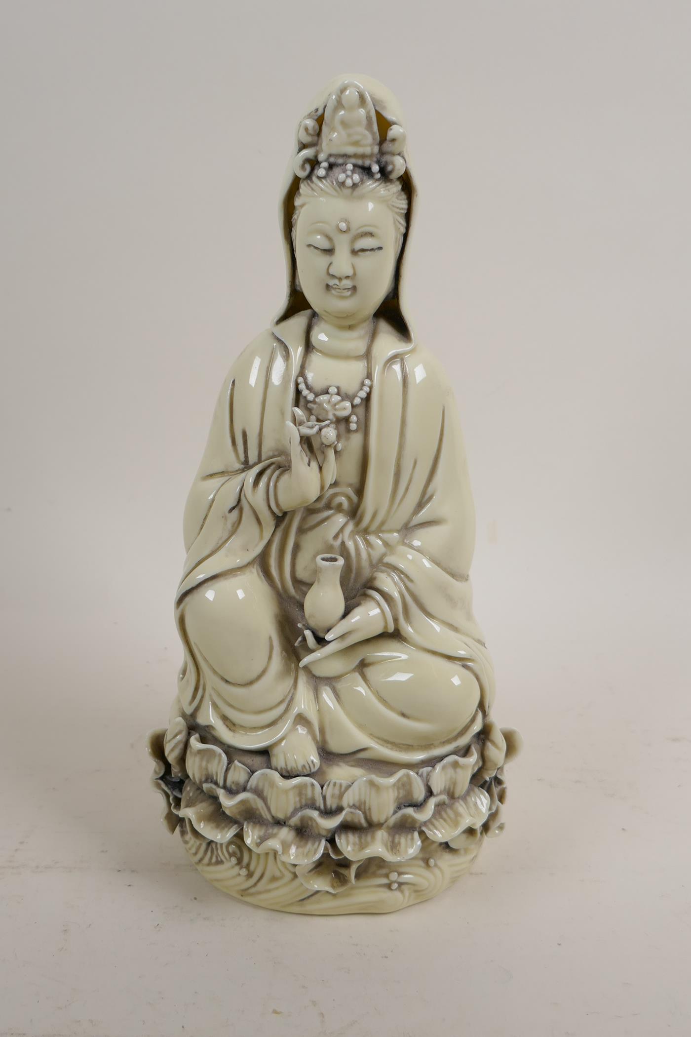 A blanc de chine figure of Quan Yin, impressed marks verso, 10" high