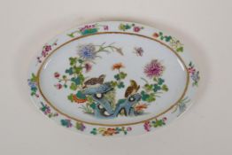 An early C20th polychrome porcelain oval dish with enamel decoration of birds and flowers, Chinese