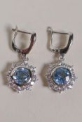 A pair of unmarked silver, cubic zirconia and aquamarine drop earrings