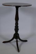 A Georgian mahogany lamp table, raised on a ring turned column with swept supports, 20" diameter x