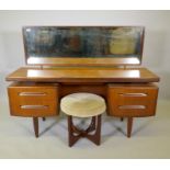 A G-Plan 'Fresco' floating top teak dressing table designed by Victor Wilkins, and a matching stool,