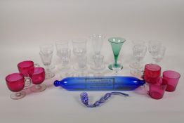 A collection of C18th and C19th glassware to include six cranberry glass custard cups, a Bristol