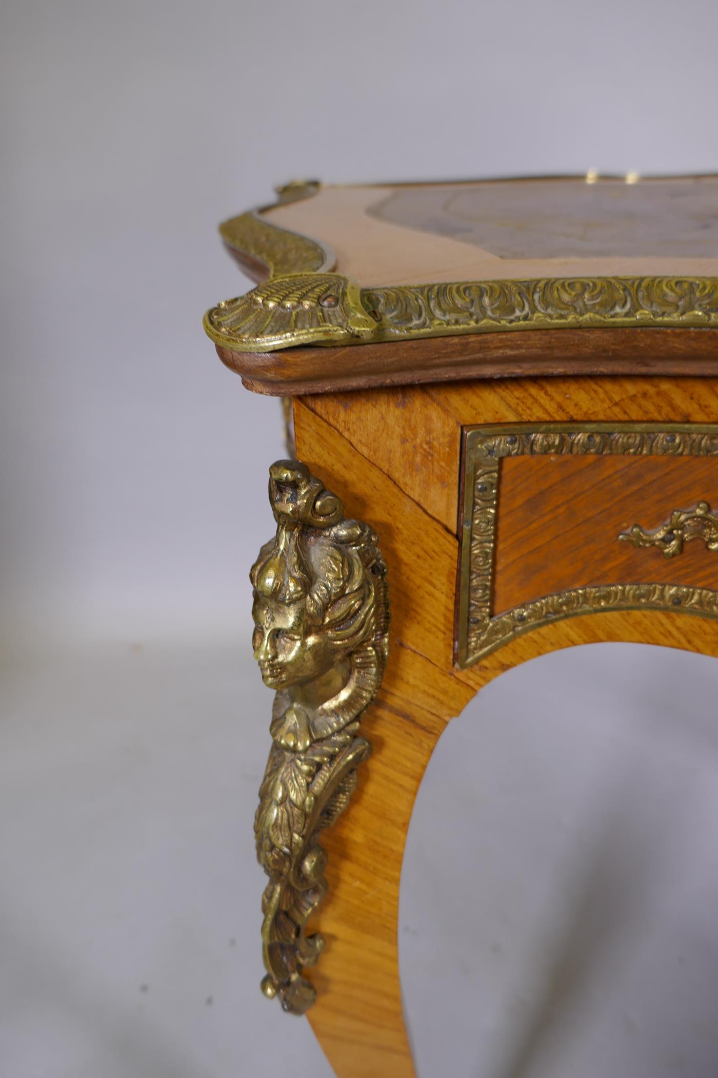 A Louis XV style inlaid tulipwood and brass mounted writing table, with inset leather top and three - Image 6 of 9